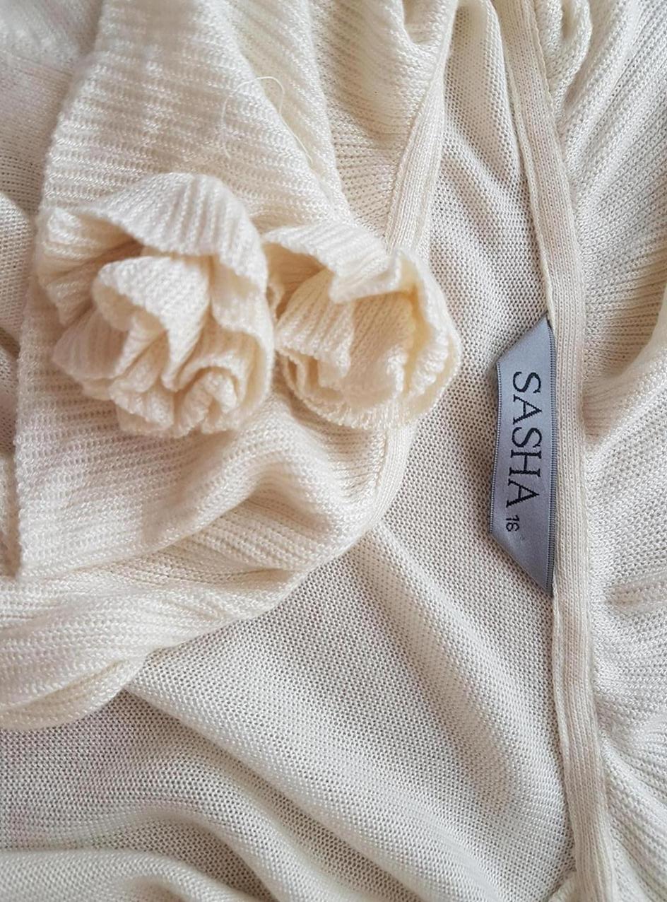 Sasha Stl 16 (44) Färg Beige Krage Draperad öppen kofta ärm 3/4 Material Viskos 100% Finstickat